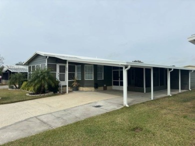 This Modern Treasure is a Beautiful Oasis!    This home is in on Lake Henry Golf Club in Florida - for sale on GolfHomes.com, golf home, golf lot