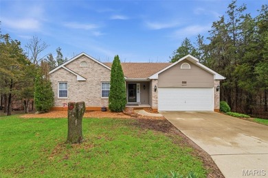 Wake up each morning to the peaceful sounds of hummingbirds and on Raintree Country Club in Missouri - for sale on GolfHomes.com, golf home, golf lot