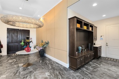 Step into the epitome of luxurious living with this exquisite on Eagle Creek Golf Club in Florida - for sale on GolfHomes.com, golf home, golf lot