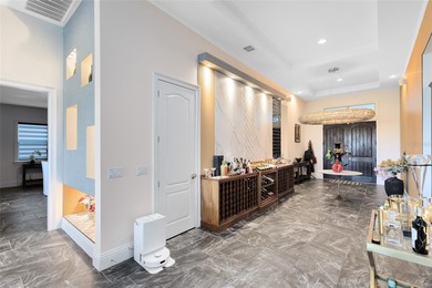 Step into the epitome of luxurious living with this exquisite on Eagle Creek Golf Club in Florida - for sale on GolfHomes.com, golf home, golf lot