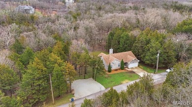 Wake up each morning to the peaceful sounds of hummingbirds and on Raintree Country Club in Missouri - for sale on GolfHomes.com, golf home, golf lot