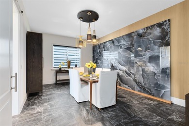 Step into the epitome of luxurious living with this exquisite on Eagle Creek Golf Club in Florida - for sale on GolfHomes.com, golf home, golf lot