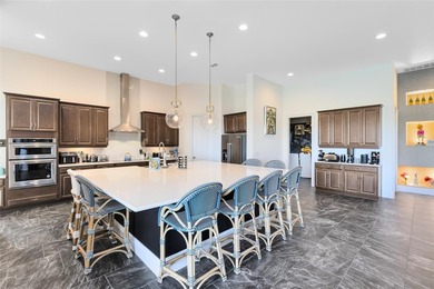 Step into the epitome of luxurious living with this exquisite on Eagle Creek Golf Club in Florida - for sale on GolfHomes.com, golf home, golf lot