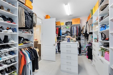 Step into the epitome of luxurious living with this exquisite on Eagle Creek Golf Club in Florida - for sale on GolfHomes.com, golf home, golf lot