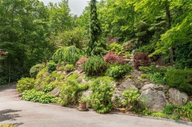 This one-of-a-kind, beautifully maintained four-bedroom on Lake Toxaway Country Club in North Carolina - for sale on GolfHomes.com, golf home, golf lot