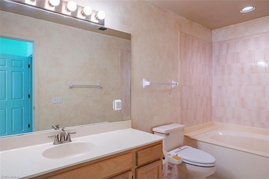 Discover tranquility in this exquisite Avignon model, a on Club at Pelican Bay Golf Course in Florida - for sale on GolfHomes.com, golf home, golf lot