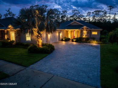 Enjoy peaceful water and wooded views in this beautifully on Venetian Bay Golf Course in Florida - for sale on GolfHomes.com, golf home, golf lot