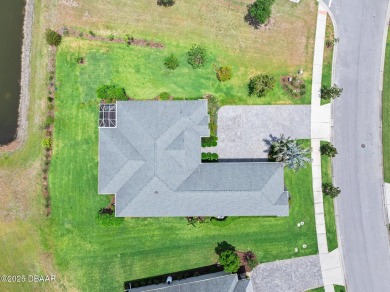 Enjoy peaceful water and wooded views in this beautifully on Venetian Bay Golf Course in Florida - for sale on GolfHomes.com, golf home, golf lot
