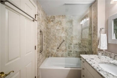 Experience the Ultimate in Tropical Living! Enjoy serene lake on Club at Pelican Bay Golf Course in Florida - for sale on GolfHomes.com, golf home, golf lot
