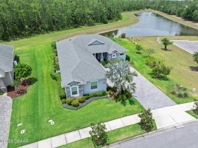 Enjoy peaceful water and wooded views in this beautifully on Venetian Bay Golf Course in Florida - for sale on GolfHomes.com, golf home, golf lot