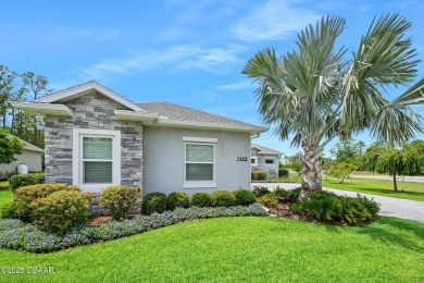 Enjoy peaceful water and wooded views in this beautifully on Venetian Bay Golf Course in Florida - for sale on GolfHomes.com, golf home, golf lot