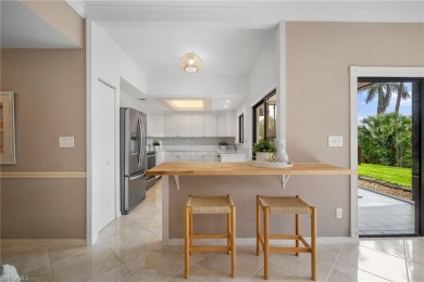 Experience the Ultimate in Tropical Living! Enjoy serene lake on Club at Pelican Bay Golf Course in Florida - for sale on GolfHomes.com, golf home, golf lot