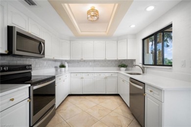 Experience the Ultimate in Tropical Living! Enjoy serene lake on Club at Pelican Bay Golf Course in Florida - for sale on GolfHomes.com, golf home, golf lot
