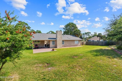 This is a fully updated coastal home on a corner lot in Panama on Holiday Golf Club in Florida - for sale on GolfHomes.com, golf home, golf lot