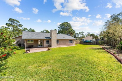 This is a fully updated coastal home on a corner lot in Panama on Holiday Golf Club in Florida - for sale on GolfHomes.com, golf home, golf lot