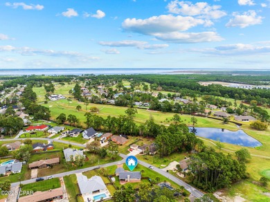 This is a fully updated coastal home on a corner lot in Panama on Holiday Golf Club in Florida - for sale on GolfHomes.com, golf home, golf lot