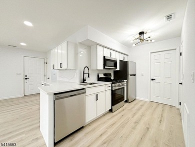 Beautifully detailed and renovated FIRST FLOOR, END UNIT on Minerals Golf Club in New Jersey - for sale on GolfHomes.com, golf home, golf lot