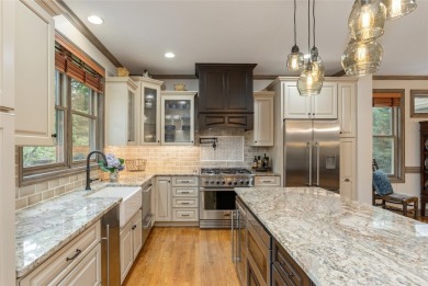 This one-of-a-kind, beautifully maintained four-bedroom on Lake Toxaway Country Club in North Carolina - for sale on GolfHomes.com, golf home, golf lot