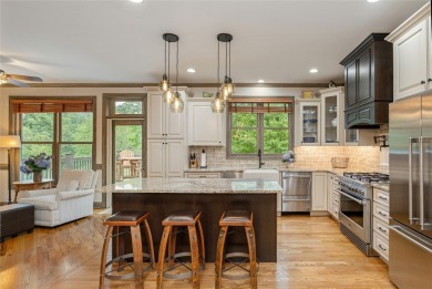 This one-of-a-kind, beautifully maintained four-bedroom on Lake Toxaway Country Club in North Carolina - for sale on GolfHomes.com, golf home, golf lot