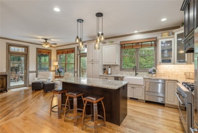 This one-of-a-kind, beautifully maintained four-bedroom on Lake Toxaway Country Club in North Carolina - for sale on GolfHomes.com, golf home, golf lot