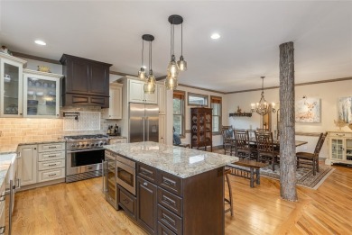 This one-of-a-kind, beautifully maintained four-bedroom on Lake Toxaway Country Club in North Carolina - for sale on GolfHomes.com, golf home, golf lot