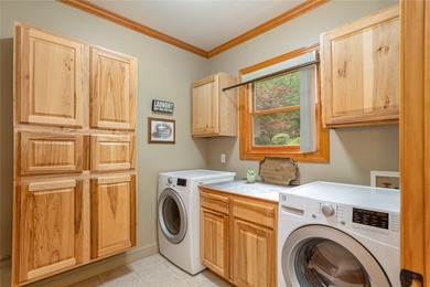 This one-of-a-kind, beautifully maintained four-bedroom on Lake Toxaway Country Club in North Carolina - for sale on GolfHomes.com, golf home, golf lot