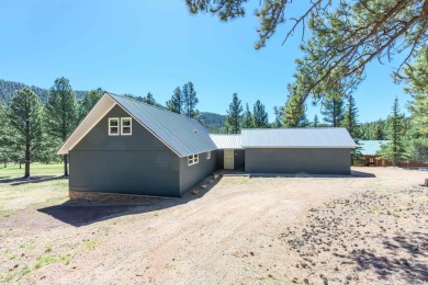 Settle into this charming mountain home overlooking the 11th on Angel Fire Resort Country Club in New Mexico - for sale on GolfHomes.com, golf home, golf lot