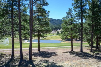 Settle into this charming mountain home overlooking the 11th on Angel Fire Resort Country Club in New Mexico - for sale on GolfHomes.com, golf home, golf lot