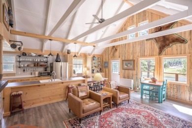 Settle into this charming mountain home overlooking the 11th on Angel Fire Resort Country Club in New Mexico - for sale on GolfHomes.com, golf home, golf lot