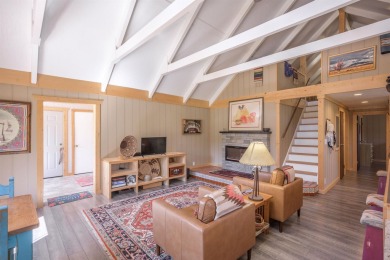 Settle into this charming mountain home overlooking the 11th on Angel Fire Resort Country Club in New Mexico - for sale on GolfHomes.com, golf home, golf lot
