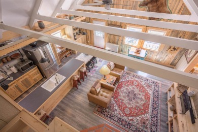 Settle into this charming mountain home overlooking the 11th on Angel Fire Resort Country Club in New Mexico - for sale on GolfHomes.com, golf home, golf lot