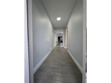 Discover the perfect family home, thoughtfully updated for on Pembroke Lakes Golf Club in Florida - for sale on GolfHomes.com, golf home, golf lot