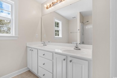 Welcome to this move-in ready, 4 bedroom, 3 bathroom home tucked on Shaftesbury Glen Golf and Fish Club in South Carolina - for sale on GolfHomes.com, golf home, golf lot