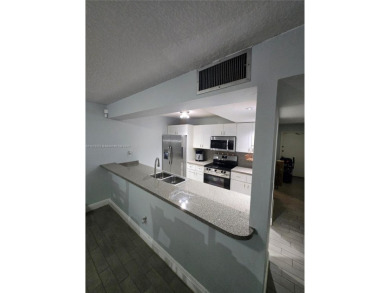 Discover the perfect family home, thoughtfully updated for on Pembroke Lakes Golf Club in Florida - for sale on GolfHomes.com, golf home, golf lot