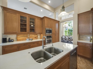 THIS GRACIOUS CUSTOM HOME HAS A GOLF MEMBERSHIP, GOLF AND LAKE on BallenIsles Golf and Country Club in Florida - for sale on GolfHomes.com, golf home, golf lot