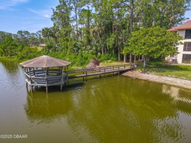 This 3 bedroom 2 bath end corner unit is nestled on the top on Indigo Lakes Golf Club in Florida - for sale on GolfHomes.com, golf home, golf lot