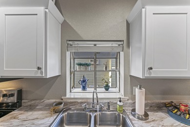 Discover luxury living in this beautifully remodeled 2-bedroom on Ledgestone Country Club and Golf Course in Missouri - for sale on GolfHomes.com, golf home, golf lot