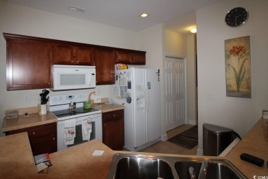 A very special  unique 3 1/2  bedroom 2 1/2  bathroom townhouse on Barefoot Resort and Golf Club  in South Carolina - for sale on GolfHomes.com, golf home, golf lot