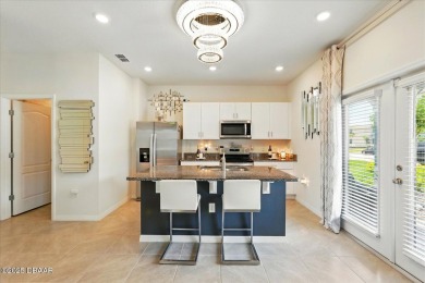 This stunning 2022 modern home in Venetian Bay is priced under on Venetian Bay Golf Course in Florida - for sale on GolfHomes.com, golf home, golf lot