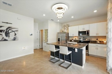This stunning 2022 modern home in Venetian Bay is priced under on Venetian Bay Golf Course in Florida - for sale on GolfHomes.com, golf home, golf lot