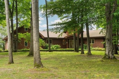 This home reflects a deep appreciation for quality and comfort on Cedar River Golf Course in Michigan - for sale on GolfHomes.com, golf home, golf lot