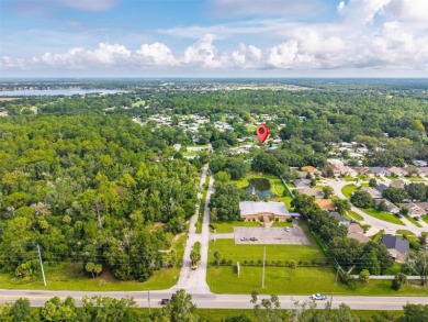 One or more photo(s) has been virtually staged. Corner-Lot Home on Country Club of Mount Dora in Florida - for sale on GolfHomes.com, golf home, golf lot