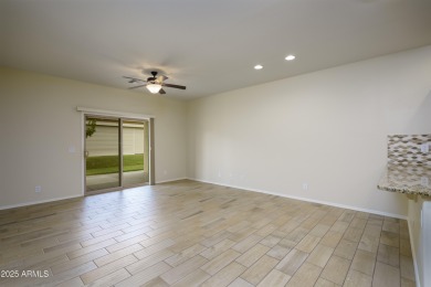 Welcome to this cozy unit with warm welcoming wood finished tile on Sunland Springs Golf Course  in Arizona - for sale on GolfHomes.com, golf home, golf lot