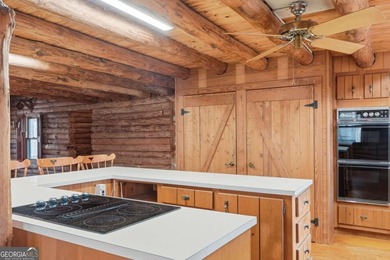 This Authentic Log Cabin Kept in It's Original Condition on The Highlands Course at Lake Arrowhead in Georgia - for sale on GolfHomes.com, golf home, golf lot
