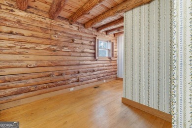 This Authentic Log Cabin Kept in It's Original Condition on The Highlands Course at Lake Arrowhead in Georgia - for sale on GolfHomes.com, golf home, golf lot