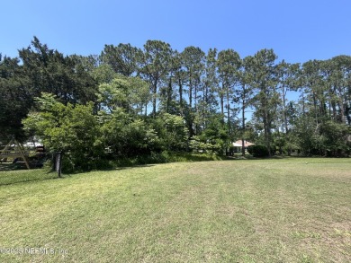 GOLF COURSE View Lot! A beautiful lot with several mature trees on St. Augustine Shores Golf Club in Florida - for sale on GolfHomes.com, golf home, golf lot