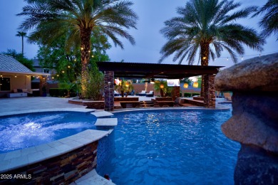 This tropical backyard oasis is a true showstopper! An oversized on Kokopelli Golf Course in Arizona - for sale on GolfHomes.com, golf home, golf lot