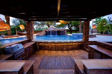 This tropical backyard oasis is a true showstopper! An oversized on Kokopelli Golf Course in Arizona - for sale on GolfHomes.com, golf home, golf lot
