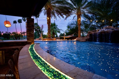 This tropical backyard oasis is a true showstopper! An oversized on Kokopelli Golf Course in Arizona - for sale on GolfHomes.com, golf home, golf lot