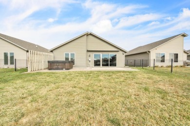 Discover comfort and convenience in this 3-bedroom, 2-bath patio on Spencer Municipal Golf Course in Iowa - for sale on GolfHomes.com, golf home, golf lot